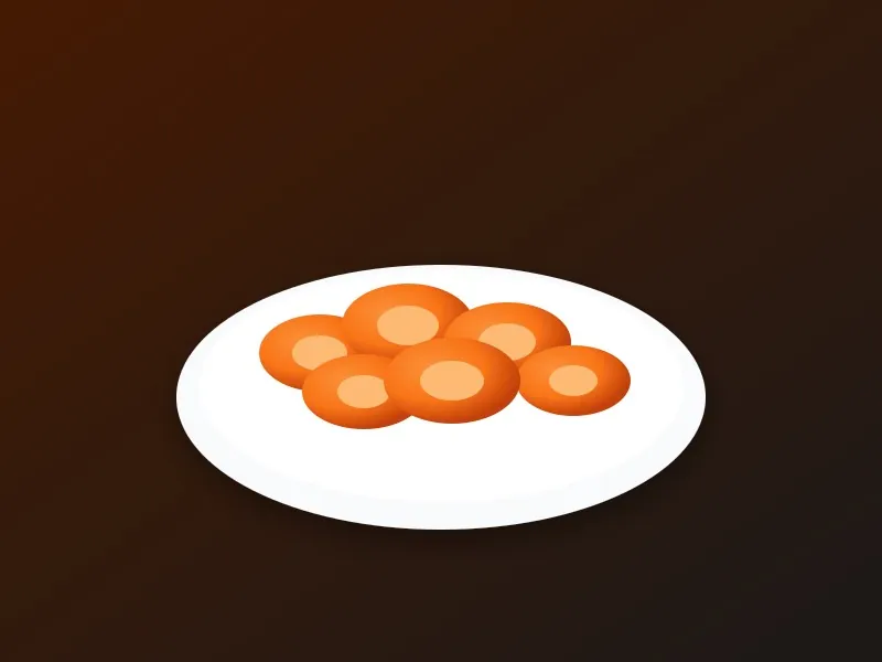 Soft sliced steamed orange carrots on a white dish